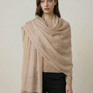 Woman wearing a draped beige pure pashmina Changthangi cashmere stole