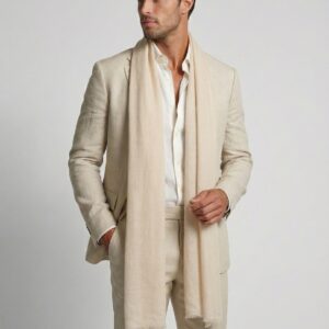 Handsome man wearing a beige suit and a pure pashmina cashmere Dune Whisper stole